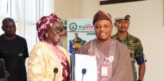 Permanent Secretary, Federal Ministry of Women Affairs, Dr Maryam Ismaila Keshinro receiving the Handing Over Notes from the former PS, FMWA, Amb. Gabriel Aduda during the ceremony held at the Ministry's Hqtrs in Abuja yesterday