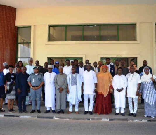 7th Right: Chairman RMAFC, Dr. M. B. Shehu OFR; DG NASRDA, Dr. Matthew Olumide Adepoju; 8th Right, Fed Commissioner Representing Bauchi State, Engr. Muhammed Sani Baba; 9th Right, Fed Commissioner Representing Kwara State, Hon. Ismaila Agaka, 6th Right, DG NASRDA, Dr. Matthew Olumide Adepoju; 5th Right, Federal Commissioner Representing Kebbi State, Barr. Rakiya A. T. Haruna mni; 4th Right, Federal Commissioner Representing FCT, Amb. Ayuba Nbako; 3rd Right, Federal Commissioner Representing Bayelsa State, Barr. Alfred Egba, and others.