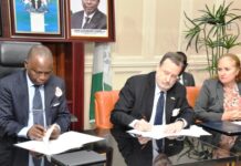 Hon. Attorney General of the Federation and Minister of Justice Lateef Fagbemi, SAN, and America Ambassador in Nigeria Richard Mills Jr., Signing Asset Return Agreement Between the Governments of Federal Republic of Nigeria and the United States of America at the Minister's Conference Room