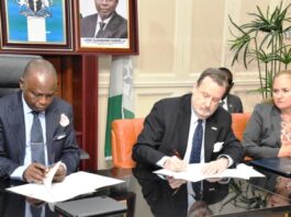 Hon. Attorney General of the Federation and Minister of Justice Lateef Fagbemi, SAN, and America Ambassador in Nigeria Richard Mills Jr., Signing Asset Return Agreement Between the Governments of Federal Republic of Nigeria and the United States of America at the Minister's Conference Room