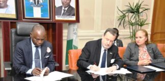 Hon. Attorney General of the Federation and Minister of Justice Lateef Fagbemi, SAN, and America Ambassador in Nigeria Richard Mills Jr., Signing Asset Return Agreement Between the Governments of Federal Republic of Nigeria and the United States of America at the Minister's Conference Room