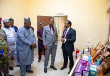 The Honourable Minister of State for Health & Social Welfare Dr. Iziaq Adekunle Salako listening to briefing by the Director-General of NIPRD, Dr. Obi Adigwe during his Familiarization visit. To his right: Dr. Salaudeen Jimoh mni, Director Hospital Services Department in the Ministry.