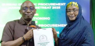 L-R: Director-General, BPP, Dr. Adebowale A. Adedokun, MCIPS, ACFE, presenting a souvenir to one of the Resource Persons & Permanent Secretary, Career Management Office, OHCSF, Mrs. Fatima S. T. Mahmoud during the Retreat