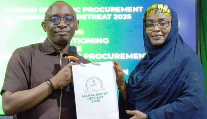 L-R: Director-General, BPP, Dr. Adebowale A. Adedokun, MCIPS, ACFE, presenting a souvenir to one of the Resource Persons & Permanent Secretary, Career Management Office, OHCSF, Mrs. Fatima S. T. Mahmoud during the Retreat