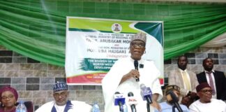 The Minister of Regional Development Engr. Abubakar Momoh delivering his address during the official inauguration of the Boards of North West and South East Development Commissions. To his right is the Minister of State, Federal Ministry of Regional Development Uba Maigari Ahmadu.