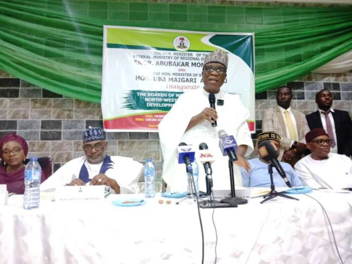 The Minister of Regional Development Engr. Abubakar Momoh delivering his address during the official inauguration of the Boards of North West and South East Development Commissions. To his right is the Minister of State, Federal Ministry of Regional Development Uba Maigari Ahmadu.