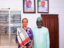 Rep. of the Permanent Secretary, D(HRM) Mr. Hassan Baba Ibrahin flanked by the MD, Zinox Technology Mrs Inkechi Eze- Okunta