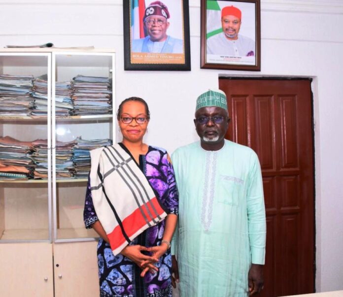 Rep. of the Permanent Secretary, D(HRM) Mr. Hassan Baba Ibrahin flanked by the MD, Zinox Technology Mrs Inkechi Eze- Okunta