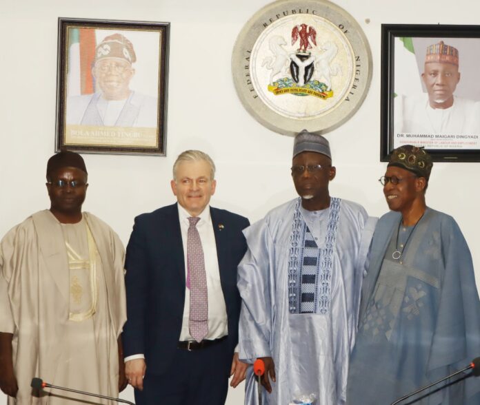 Minister of Labour and Employment, Dr Muhammad Maigari Dingyadi (2nd right); Permanent Secretary, Labour and Employment, Dr Salihu A. Usman (left); former Minister of Information and Culture, Alhaji Lai Mohammed (right); Dr. Matthias Leder, President, IHK Giessen-Friedberg Chamber of Commerce and Industry, Germany, during the Chamber's courtesy visit to the Minister in Abuja