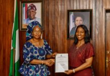 (L-R), Permanent Secretary, Service Welfare Office, Mrs Patience Oyekunle Nwakuso receiving the handing over notes from the former Director, Overseeing the office, Dr Comfort Adeosun.