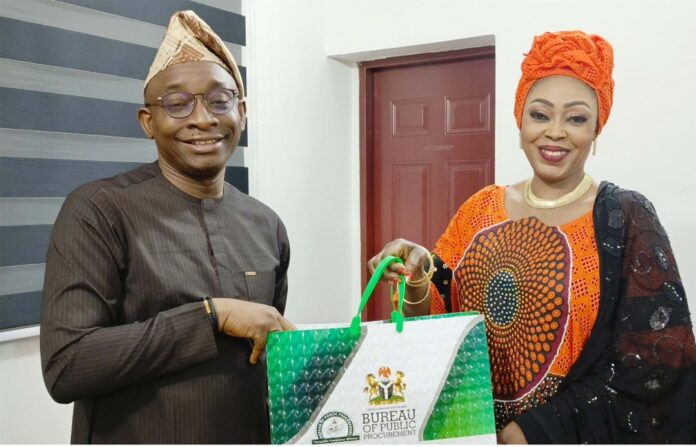 L:R: Director-General, Bureau of Public Procurement, BPP, Dr. Adebowale A. Adedokun, MCIPS, ACFE presenting a souvenir to the National Coordinator, Open Government Partnership, Dr. Gloria Ahmed  during her visit to BPP today, 19th February, 2025