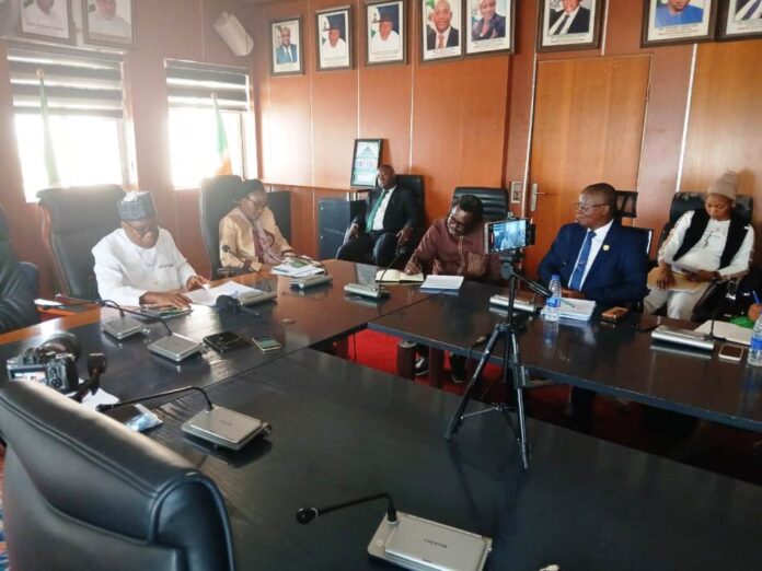 The Honourable Minister of Regional Development Engr. Abubakar Momoh addressing members of the Academic Associates PeaceWorks (AAPW) during a working visit in his office, in Abuja.