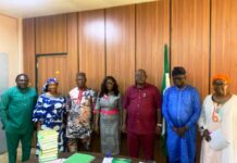 4th from left, Acting Secretary, NNMA, Mrs. Mercy Maltida Musa Moro'a, 3rd from right Dr. Onwusoro Maduka Ihemelandu, PS - FMSDIGA and 1st from right Director ( Parastatals) FMSDIGA in a group photograph with the NNMA Management Team.