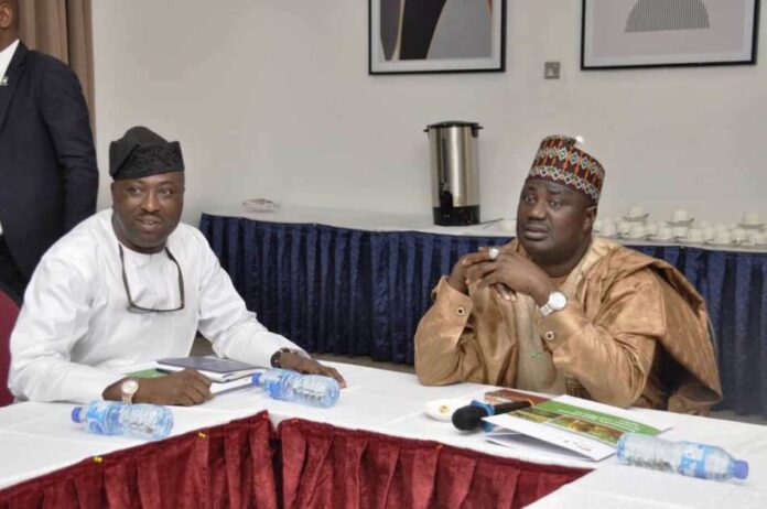 The Director, Agricultural Land and Climate Change Management Services, Mr Olanipekun Oshadiya and Minister of State for Agriculture and Food Security, Sen.Dr Aliyu Sabi Abdullahi, during the Final Validation Workshop held in Abuja