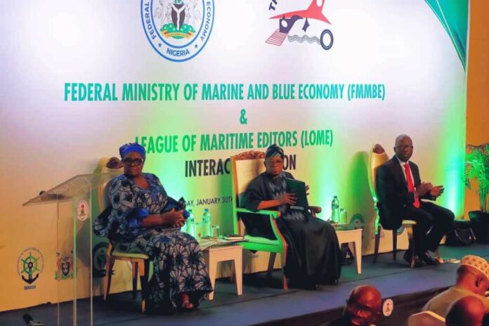 The Honourable Minister, Marine and Blue Economy (m), the Permanent Secretary, Federal Ministry of Marine and Blue Economy, Oloruntola Olufemi (r) and the President, League of Maritime Editors, Remilekun Itie (l).