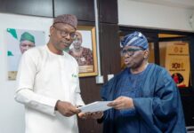 Honourable Minister of State for Health & Social Welfare Dr. Iziaq Adekunle Salako receiving First Quarter Report on Elimination of Cervical Cancer from Prof. Isaac Adewole, Committee Chairman.