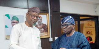 Honourable Minister of State for Health & Social Welfare Dr. Iziaq Adekunle Salako receiving First Quarter Report on Elimination of Cervical Cancer from Prof. Isaac Adewole, Committee Chairman.