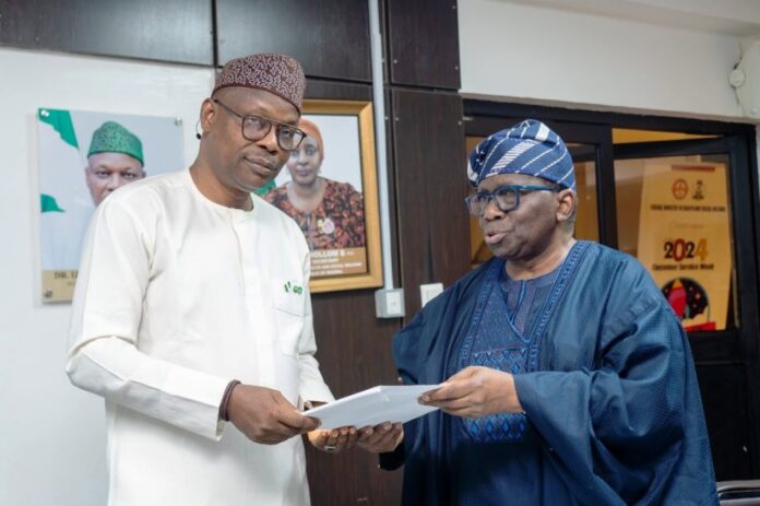 Honourable Minister of State for Health & Social Welfare Dr. Iziaq Adekunle Salako receiving First Quarter Report on Elimination of Cervical Cancer from Prof. Isaac Adewole, Committee Chairman.