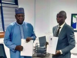R-L the outgoing Permanent Secretary Adeleye Adeoye holding the handover notes while the Acting Permanent Secretary/Director, Road Transport and Mass Transit Administration Musa Ibrahim holds a copy of the handover notes. He takes over the mantle to oversee the office of the Permanent Secretary, pending the deployment of a substantive Permanent Secretary.