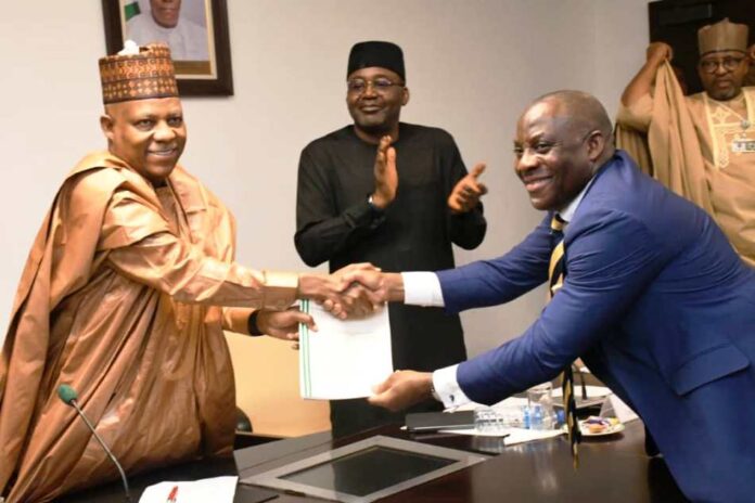 Vice President Kashim Shettima receiving document sign from the Minister of Education, Dr. Maruf Olatunji Alausa during the signing ceremony and handover of landed property to the Federal Government by the EFCC for the takeoff of the Federal University of Applied Sciences, Southern Kaduna at the Presidential Villa in Abuja on Tuesday (11/02/2025).