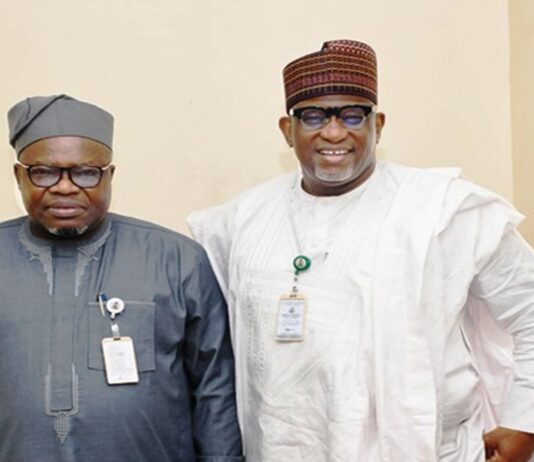 L-R : The Surveyor General of the Federation (SGOF) Abduganiyu Adeyemi Adebomehin next to him is Permanent Secretary of the Federal Ministry of Housing and Urban Development Dr Shuaib Belgore at the briefing