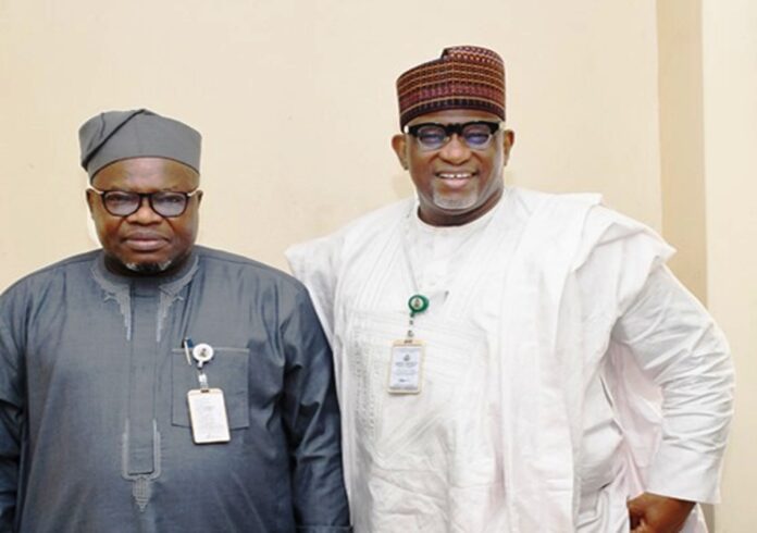 L-R : The Surveyor General of the Federation (SGOF) Abduganiyu Adeyemi Adebomehin next to him is Permanent Secretary of the Federal Ministry of Housing and Urban Development Dr Shuaib Belgore at the briefing