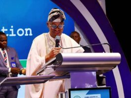 The Honourable Minister of Marine and Blue Economy, Adegboyega Oyetola, CON, speaks at the symposium.