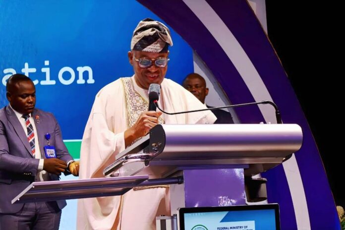 The Honourable Minister of Marine and Blue Economy, Adegboyega Oyetola, CON, speaks at the symposium.