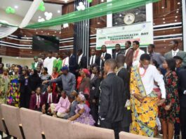 The Honourable Minster of Education Dr Maruf Tunji Alausa, the Honourable Minster of State for Education Prof Suwaiba Said Ahmad and Directors surrounded by students celebrating Commonwealth day in the Ministry headquarters.Abija