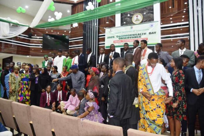 The Honourable Minster of Education Dr Maruf Tunji Alausa, the Honourable Minster of State for Education Prof Suwaiba Said Ahmad and Directors surrounded by students celebrating Commonwealth day in the Ministry headquarters.Abija