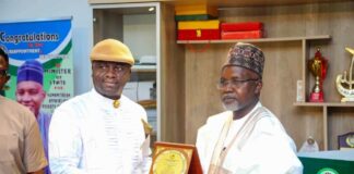 Right, Honourable Minister of State Federal Ministry of Humanitarian Affairs and Poverty Reduction, Dr Yusuf Tanko Sununu, Danmadamin Yauri receiving a Plaque of Honour in recognition of his contributions to humanity and National Development from the National Chairman, Niger Delta People Salvation Front (NDPSF) Alabo Engr Obomate Harry, during a working visit by the group to the Minister of State on Friday 28th February 2025 Federal Secretariat Abuja