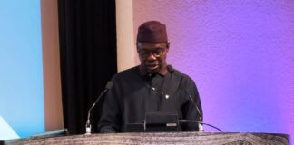 Dr. Iziaq Adekunle Salako delivering the keynote address at the UK - Africa Health Summit in London.