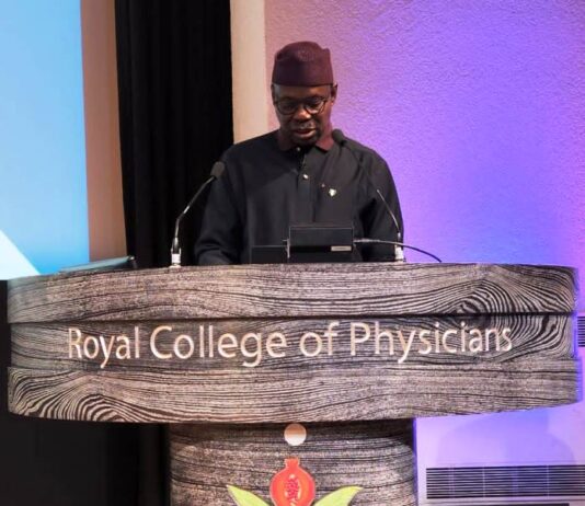 Dr. Iziaq Adekunle Salako delivering the keynote address at the UK - Africa Health Summit in London.