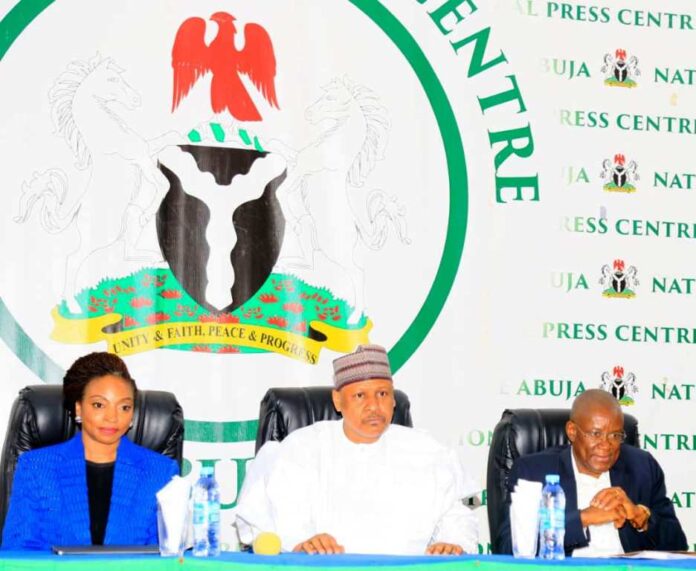 The Hon. Min . Trade and Investment, FMITI, Dr. Jumoke Oduwole (left) the Hon. Min. of Information and National Orientation, Mohammed Idris, (middle) the Hon.Min of State (Industry) FMITI, Sen. John Owan Enoh (right) during the Ministerial Press briefing hosted by the Federal Ministry of Information and National Orientation in Abuja on Tuesday 05/03/25.