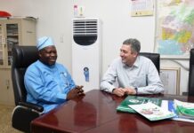 L-R : Surveyor General of the Federation (SGOF) Abduganiyu Adeyemi Adebomehin making a point of interest while with the Partner, Field Operator ofhe US company , the PLACE and team leader to Nigeria Frank Pichel