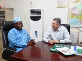 L-R : Surveyor General of the Federation (SGOF) Abduganiyu Adeyemi Adebomehin making a point of interest while with the Partner, Field Operator ofhe US company , the PLACE and team leader to Nigeria Frank Pichel