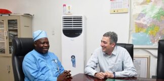 L-R : Surveyor General of the Federation (SGOF) Abduganiyu Adeyemi Adebomehin making a point of interest while with the Partner, Field Operator ofhe US company , the PLACE and team leader to Nigeria Frank Pichel