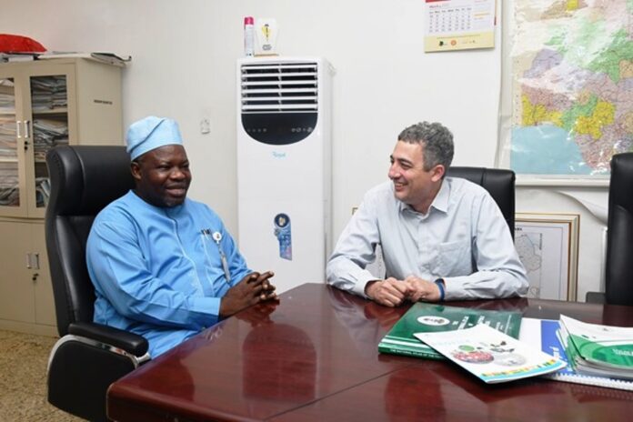 L-R : Surveyor General of the Federation (SGOF) Abduganiyu Adeyemi Adebomehin making a point of interest while with the Partner, Field Operator ofhe US company , the PLACE and team leader to Nigeria Frank Pichel