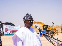 The Honourable Minister of Water Resources and Sanitation, Engr. Prof. Joseph Terlumun Utsev, FNSE, FNICE, FNIWE, delivering his address during the flag-off ceremony