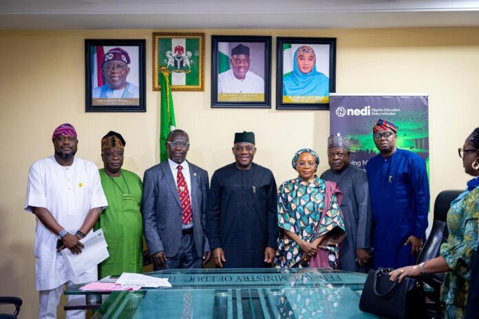 The Honourable Minister of Education Dr Maruf Tunji Alausa flakes with the new appointees and UBEC Executive Secretary Hajiya Aisha Garba