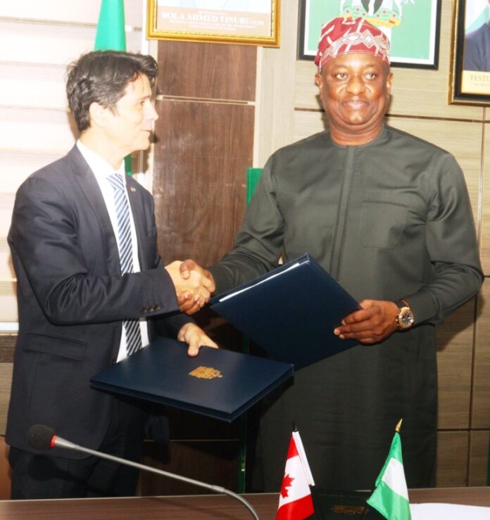 Pasquale Salvaggio in a handshake with Festus Keyamo, SAN during the Bilateral Air Service Agreement between the Canadian Authority in Abuja.