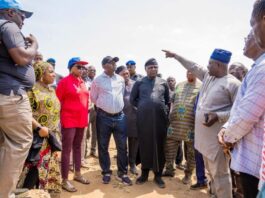 The Honourable Minister, Engr. Prof. Joseph Terlumun Utsev, flanked by the Permanent Secretary, Mr. Richard Pheelangwah, Directors of the Ministry and community stakeholders during the inspection of Markurdi Irrigation Project at Mbaku Community, Benue State