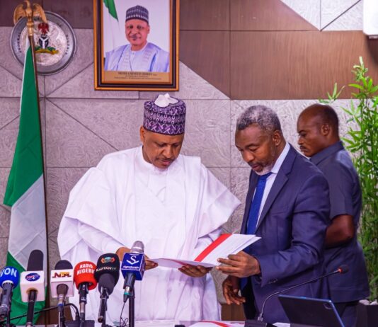 Hon Minister of Information and National Orientation, Mohammed Idris fnipr appreciating the letter conveying Nigeria's selection as the approved host for the 2026 World Public Relations Forum. with him is the President of the Nigeria Institute of Public Relations, Dr. Ike Neliaku