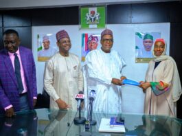 Signing of MoU between the National Hospital Abuja and Four Private Institutions: the Coordinating Minister for Health & Social Welfare Prof. Muhammad Ali Pate holding the MoU booklet with the CEO, Concerned Medix Foundation (a Diaspora based Nigerian Organization) 2ndLeft: Prof. Raji Mahmud Chief Medical Director National Hospital Abuja: Left: Barrister Tobi Omosa Director Legal Service Department of the Ministry.