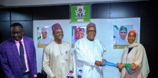 Signing of MoU between the National Hospital Abuja and Four Private Institutions: the Coordinating Minister for Health & Social Welfare Prof. Muhammad Ali Pate holding the MoU booklet with the CEO, Concerned Medix Foundation (a Diaspora based Nigerian Organization) 2ndLeft: Prof. Raji Mahmud Chief Medical Director National Hospital Abuja: Left: Barrister Tobi Omosa Director Legal Service Department of the Ministry.