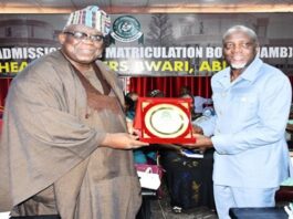 FCSC Chairman, Prof. Tunji Olaopa (Left) presented with a plaque by Registrar of JAMB; Prof. Ishaq Oloyede at the event.