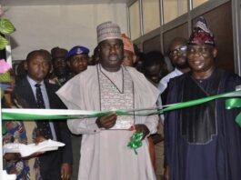 L-R. The Minister of State for Agriculture and Food Security, Sen.Dr Aliyu Sabi Abdullahi and Director, Department of Agricultural Extension Services, Dr Deola Tayo Lordbanjou during the unveiling of the NEEP back-end office in Abuja