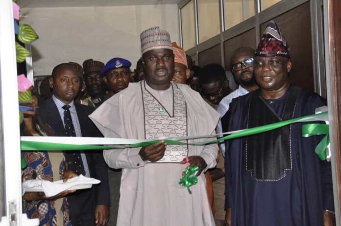 L-R. The Minister of State for Agriculture and Food Security, Sen.Dr Aliyu Sabi Abdullahi and Director, Department of Agricultural Extension Services, Dr Deola Tayo Lordbanjou during the unveiling of the NEEP back-end office in Abuja