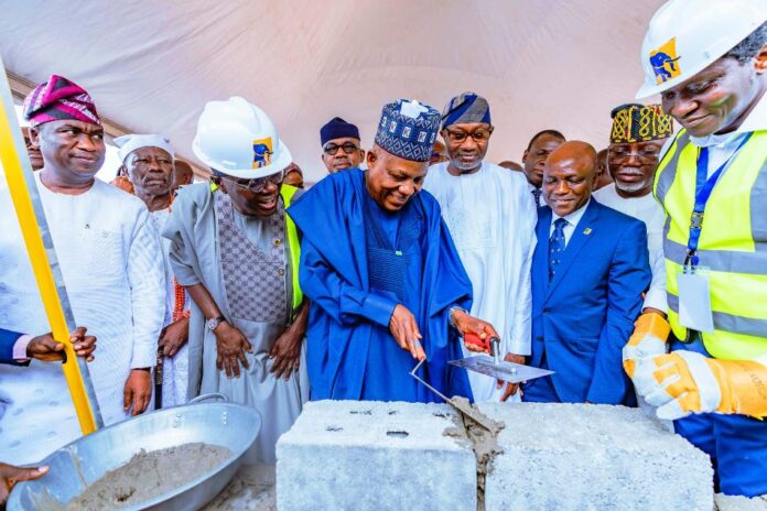 Vice President Kashim Shettima (middle); Lagos State Governor Babajide Sanwo-Olu (2nd from left); Deputy Governor of Lagos State, Obafemi Hamzat (far left); Chairman of First Bank of Nigeria Holdings, Femi Otedola (3rd from right); Managing Director/Chief Executive Officer (MD/CEO) of First Bank, Olusegun Alebiosu (2nd from right); and Ondo State Governor Lucky Aiyedatiwa (far right) during the groundbreaking and official foundation-laying ceremony of First Bank of Nigeria’s (FBN) new 40-story headquarters in Eko Atlantic City, Lagos, on Wednesday, 05/03/2025.