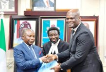 The Honourable Attorney-General of the Federation and Minister of Justice, Prince Lateef Fagbemi SAN, receiving the Report from the Facilitator of the Working Group on the Legal Status of Inmates in Correctional Centres, Olawale Fapohunda (SAN) on Wednesday 19th March, 2025 in Abuja.